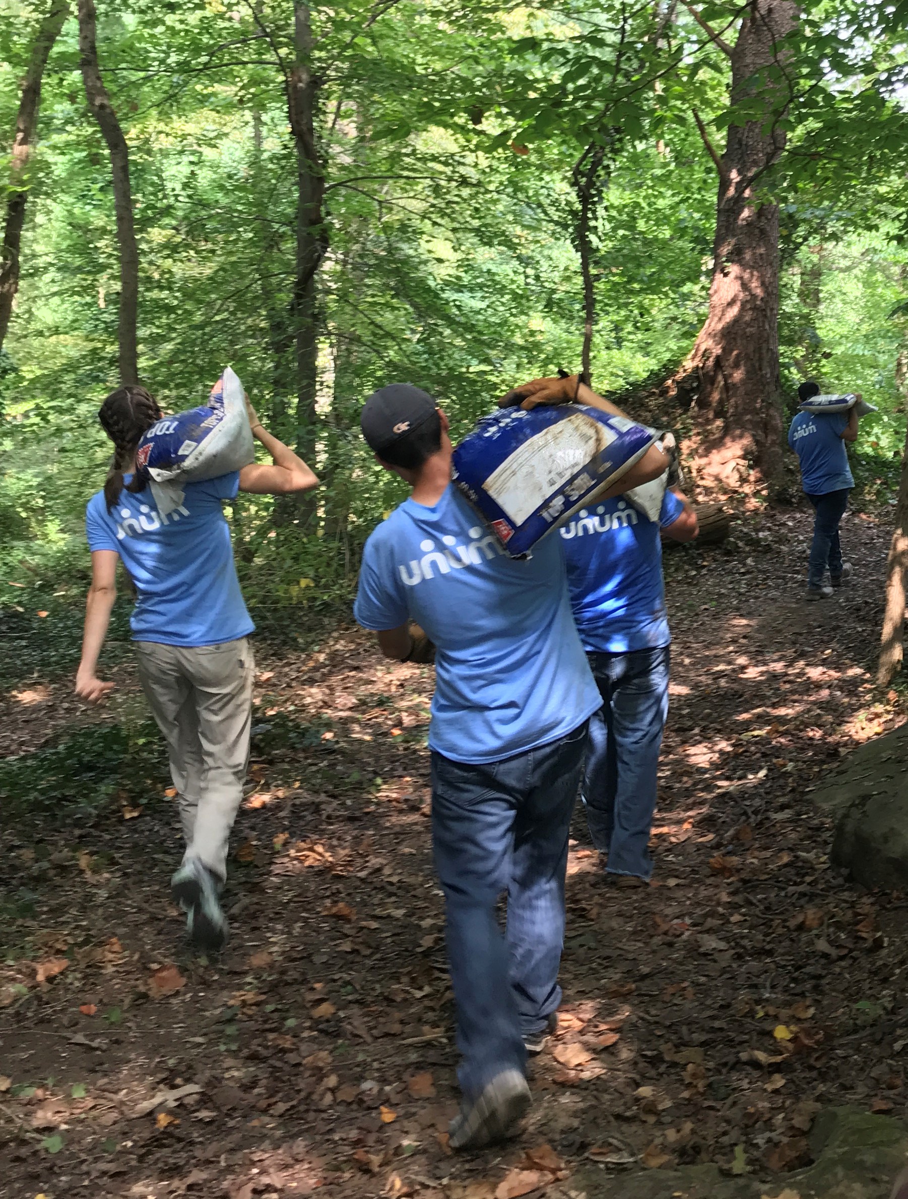 Unum carrying bags of dirt