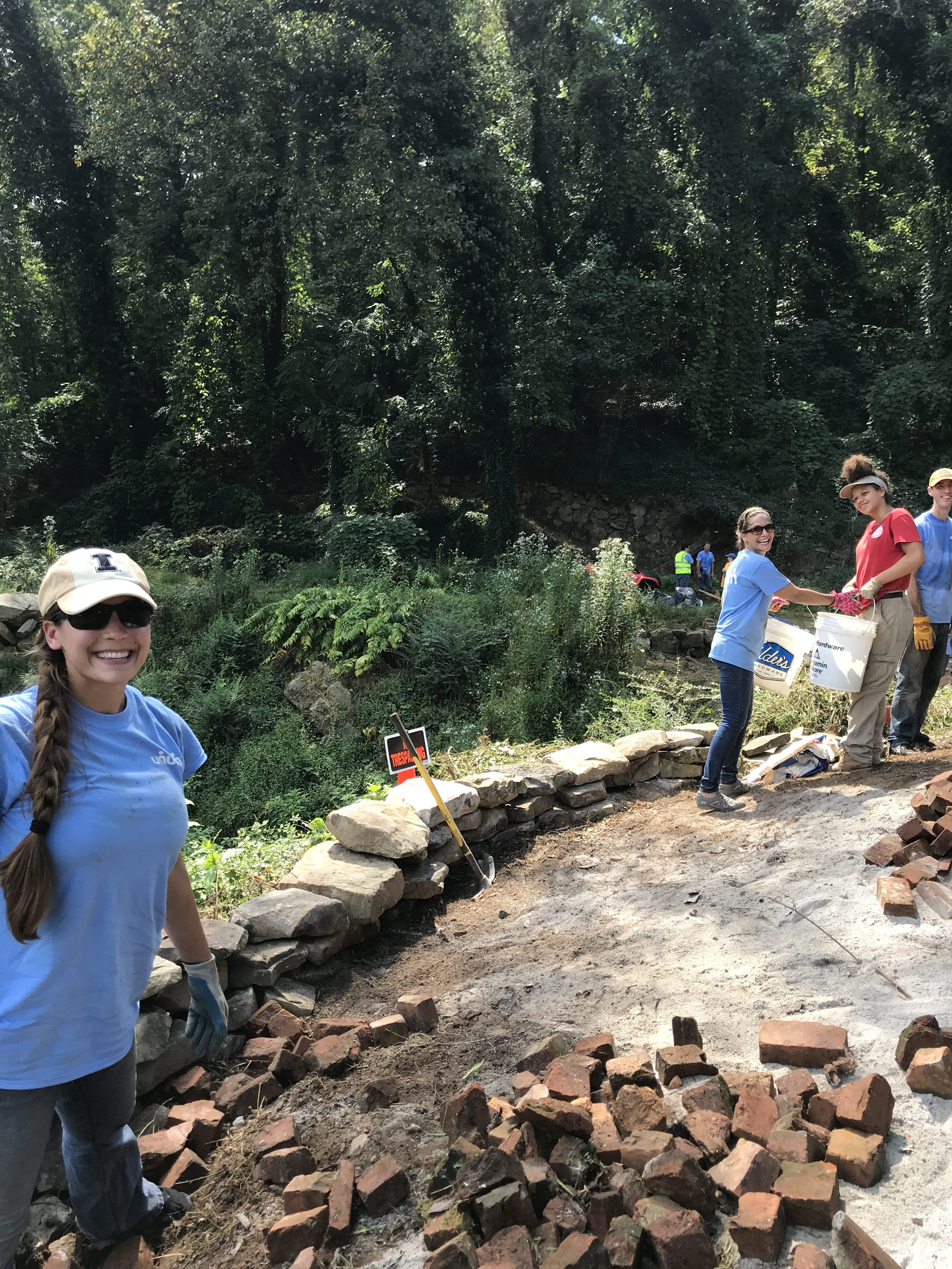 Group from Unum working on boulder