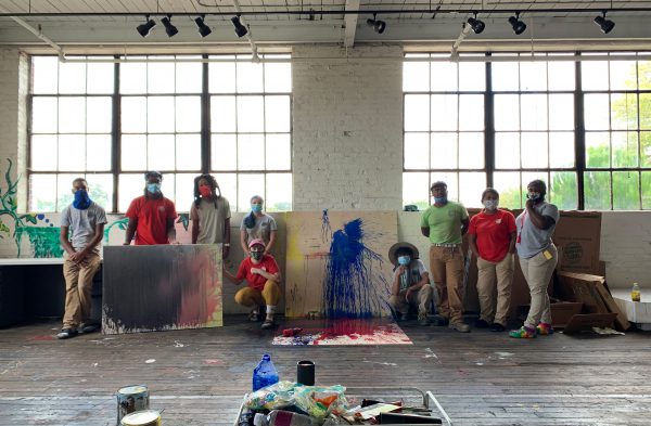 Picture of interns and Genesis after creating their original art piece