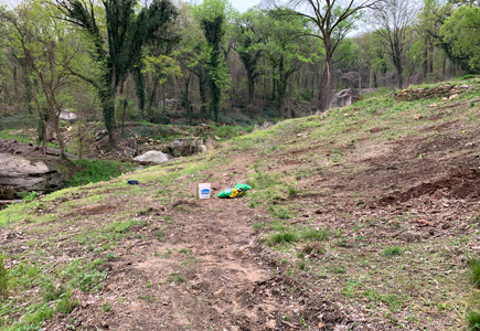 Pollinator garden after picture, cleared area with a trail outline as well