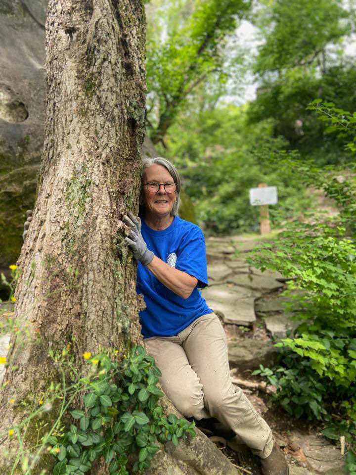 Robyn Carlton Hugging a tree on Earth Day