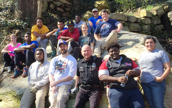 group of volunteers on rock